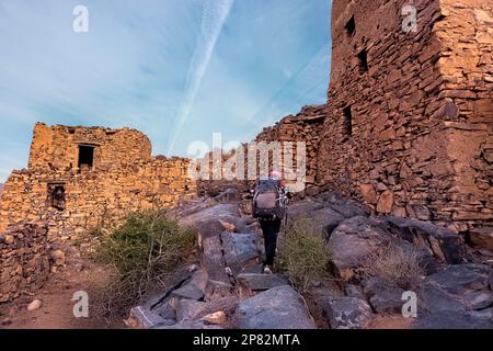 Trekking to Jebel Shams through the ruins of Wadi Ghul, Al Hamra, Oman Stock Photo
