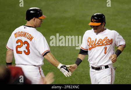 Baltimore Orioles' Brian Roberts congratulates Melvin Mora after Mora hit a  two-run homer, scoring Roberts, off Houston Astros pitcher Wandy Rodriguez  in the first inning Wednesday, June 15, 2005, in Baltimore.(AP Photo/Gail