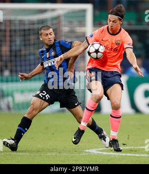 Barcelona forward Zlatan Ibrahimovic, of Sweden, at left in orange jersey,  tramples over Inter Milan Brazilian goalkeeper Julio Cesar, as teammate  Brazilian defender Lucio looks on, during their Champions League, Group F  soccer match at the San Siro