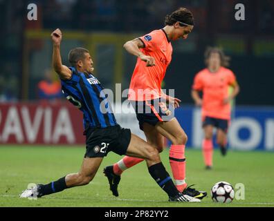 Barcelona forward Zlatan Ibrahimovic, of Sweden, at left in orange jersey,  tramples over Inter Milan Brazilian goalkeeper Julio Cesar, as teammate  Brazilian defender Lucio looks on, during their Champions League, Group F  soccer match at the San Siro