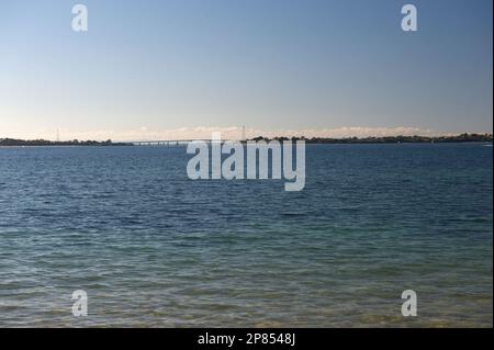 San Remo, in Victoria, Australia, is the gateway to Phillip Island, across the bridge in the distance. San Remo Channel has strong tidal rips. Stock Photo