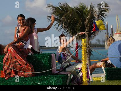 https://l450v.alamy.com/450v/2p85k0b/miss-dominican-republic-ada-aimee-de-la-cruz-left-and-miss-colombia-michelle-rouillard-right-wave-along-with-others-from-atop-a-moving-float-during-a-parade-given-for-contestants-of-the-2009-miss-universe-competition-in-nassau-bahamas-thursday-aug-20-2009-miss-universe-2009-will-be-picked-from-among-participants-from-84-countries-on-aug-23-ap-photobrennan-linsley-2p85k0b.jpg