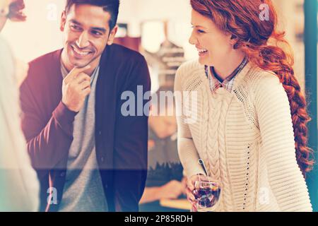Dynamic designers. a team of young designers discussing their work in the office. Stock Photo