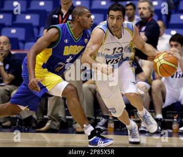 Canada's Jermaine Anderson, right, drives with the ball guarded by Brazil's  Leandro Barbosa during their basketball game of the Marchand Continental  Cup in San Juan, Thursday, Aug. 20, 2009. Brazil won 87-69. (AP  Photo/Ricardo Arduengo Stock Photo