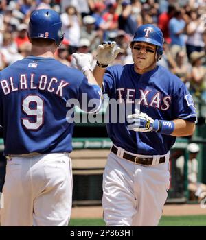 Texas Rangers' Adrian Beltre rounds the bases after hitting a home run  against the Detroit Tigers during a baseball game Saturday, May 24, 2014,  in Detroit. The Tigers and Rangers are celebrating