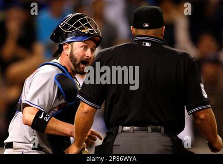 Home plate umpire Marvin Hudson warns New York Yankees manager Joe