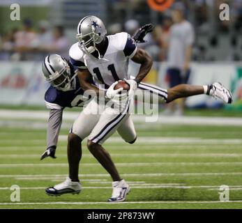 Detroit Lions wide receiver Roy Williams (11) gets around Dallas Cowboys  defender Anthony Henry after a reception in the third quarter. The Lions  defeated the Cowboys, 39-31, at Texas Stadium in Irving