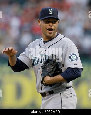 Seattle Mariners catcher Rob Johnson (32) visits Felix Hernandez on the  mound in the sixth inning of a baseball game against the Texas Rangers  Tuesday, June 8, 2010, in Arlington, Texas. Hernandez