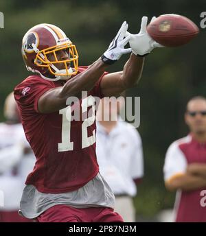 30 July 2009: Wide Reciever Terrell Owens of the Buffalo Bills unveils the  new throwback uniforms after the Bills Thursday night practice at St. John  Fisher College in Pittsford, New York. (Icon