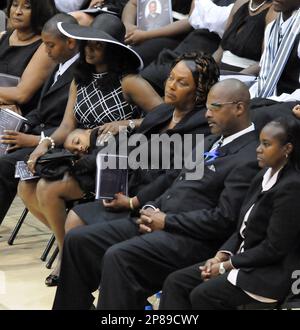 Lucille McNair, seated center, mother of Steve McNair, is consoled by family  and friends during the funeral service for Steve McNair in Hattiesburg,  Miss., Saturday, July 11, 2009. McNair, a former NFL