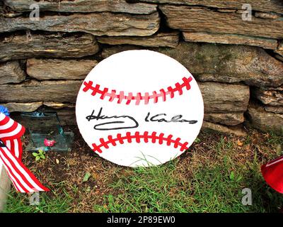 A baseball sits on the grave stone of famed Chicago Cubs