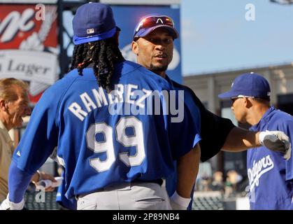 Los Angeles Dodgers' Gary Sheffield and San Diego Padres catcher Ben Davis  follow the flight of Sheffield's 419 foot home run in the first inning of  their game Wednesday, Oct. 3, 2001