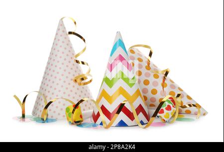 Party hats, blowers and confetti streamers on white background Stock ...