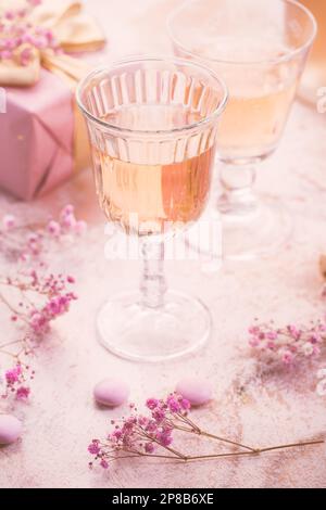Rose sparkling wine, French macarons and box of chocolates for Valentine, mothers day or birthday Stock Photo