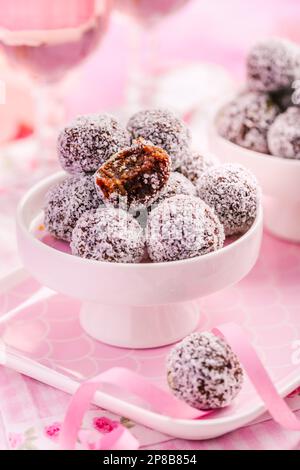 Energy protein balls with healthy ingredients, made with dates, peanut butter, flax and chia seeds, oats, almond and chocolate drops Stock Photo