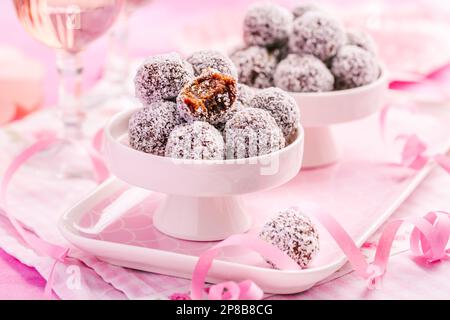 Energy protein balls with healthy ingredients, made with dates, peanut butter, flax and chia seeds, oats, almond and chocolate drops Stock Photo