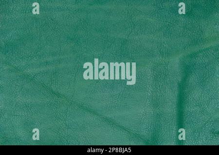 Green leather cut as background textured and wallpaper. Rustic style Stock Photo
