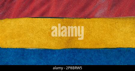 Assorted pieces of skin. Rawhide. Blue, yellow and red leather pieces. Pieces of colored leather Stock Photo