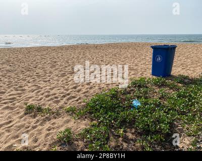 Candolim, Goa, India - January 2023: A garbage bin on a pristine beach in the village of Sinquerim in Goa. Stock Photo