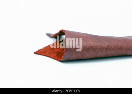 Red leather is folded on a white background Stock Photo