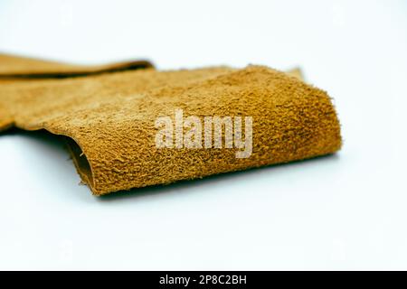 Brown leather is folded on a white background Stock Photo