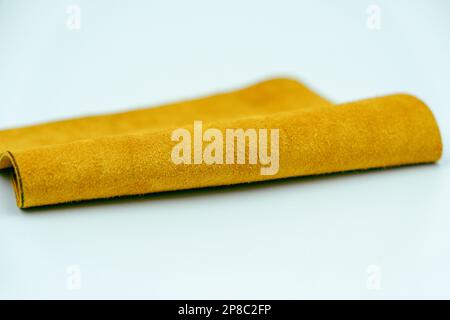 Yellow leather is folded on a white background Stock Photo