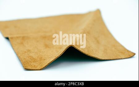 Brown leather is folded on a white background Stock Photo