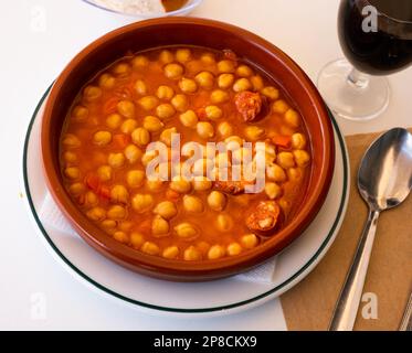 Garbanzos a la riojana, a spanish chickpeas stew with ham Stock Photo