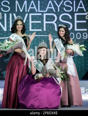 Newly crowned Miss Malaysia Universe Joannabelle Ng Li Vun, 21, center, poses with 1st runner-up Cassandra Patrick, 24, left, and 2nd runner-up Claudia Tania Sibert, 24, after the beauty pageant in Kuala Lumpur, Malaysia, Saturday, May 30, 2009. (AP Photo/Lai Seng Sin)