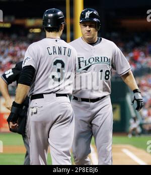 Florida Marlins' Jorge Cantu bumps arms with Dan Uggla, who hit a