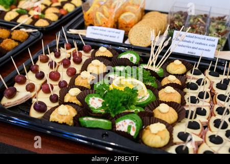 Close-up overhead view of plastic trays with assorted canapes Stock Photo