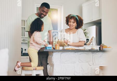 Happy little girl help mom cooking in kitchen Stock Photo - Alamy