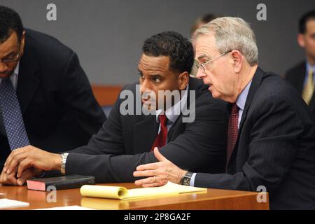 Jayson Williams defense team members, from left, attorney Billy Martin,  spokeswoman Judy Smith and attorney Joseph A. Hayden Jr. walk arm in arm  from the Somerset County Courthouse in Somerville, N.J., following