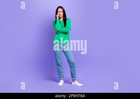 Full size photo of depressed offended lady look side hand fist on cheek show disobedience isolated purple color background Stock Photo