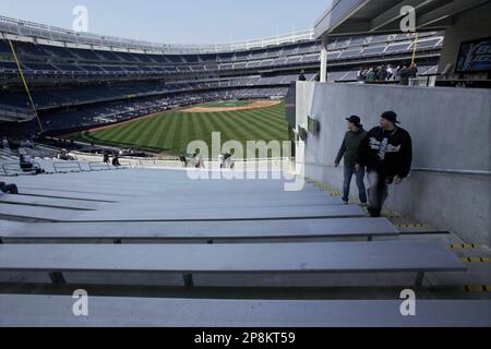 Fans in the right-field bleachers reach out for New York Yankees' Nick  Swisher's home run off Tampa Bay Rays starting pitcher James Shields in a  baseball game at Yankee Stadium in New