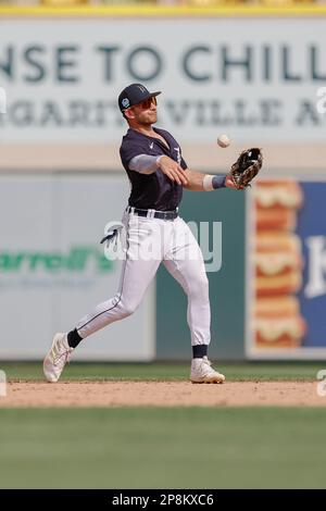 Lakeland FL USA; Detroit Tigers shortstop Gage Workman (27) fields a hard hit ball by Washington Nationals left fielder Daylen Lile (13) and throws to Stock Photo
