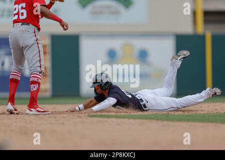 Lakeland FL USA; Detroit Tigers shortstop Gage Workman (27) steals second base during an MLB spring training game against the Washington Nationals at Stock Photo