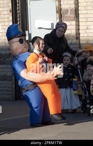 OPTICAL ILLUSION. A young hasidic Jewish boy in a clever Purim costume. In Brooklyn, New York City. Stock Photo