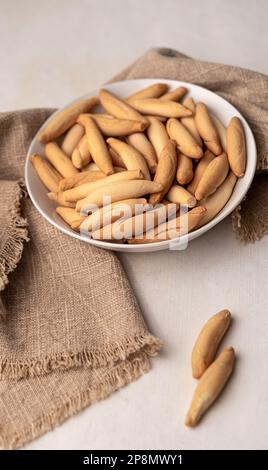Spanish mini picos bread sticks in bowl Stock Photo