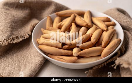 Spanish mini picos bread sticks in bowl Stock Photo