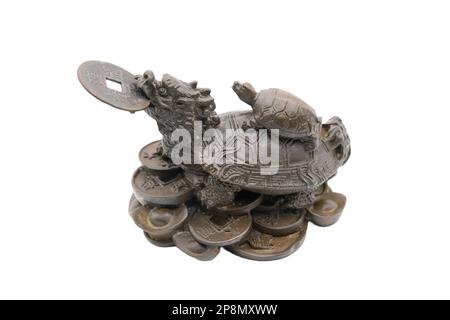 Dragon turtle with baby turle holding coin in its mouth isolated on white background signifying prosperity and good fortune. Stock Photo