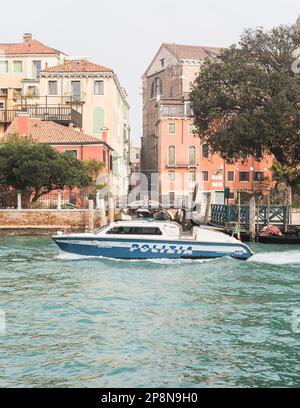 police boat navigating the gran canal in Venice, Italy Stock Photo