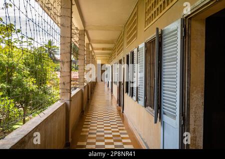 A corridor past former classrooms in the notorious Tuol Sleng S-21 torture and genocide prison museum in Phnom Penh, Cambodia. More than 18,000 peopl Stock Photo