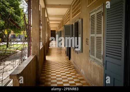 A corridor past former classrooms in the notorious Tuol Sleng S-21 torture and genocide prison museum in Phnom Penh, Cambodia. More than 18,000 people Stock Photo