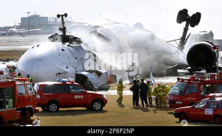 NARITA, Japan - Firefighters hose a FedEx plane at Narita International ...