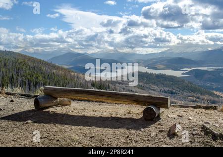 Wooden Bench with view of Lake Dillon from Ptarmagin Trail, Colorado, USA. Stock Photo