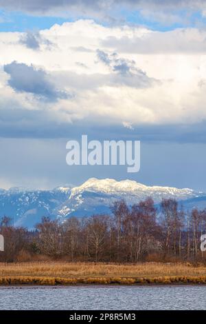 Coastal mountains rising above Vancouver in British Columbia Canada Stock Photo