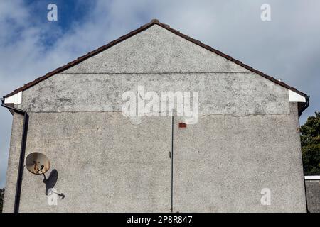 Damage to a previous roughcast repair on the gable of a house, Scotland, UK, Europe Stock Photo