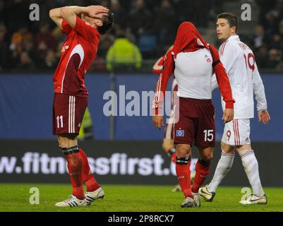 hamburgs ivica olic left and teammate piotr trochowski react after trochowski tried to score while galatasaraysharry kewell watches the scene during the uefa cup first leg quarterfinal soccer match between hamburger sv and galatasaray istanbul in hamburg germany thursday march 12 2009 the match ended in a 1 1 draw ap photofabian bimmer