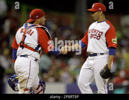 Puerto Rico's catcher Yadier Molina (4) chases down Japan's